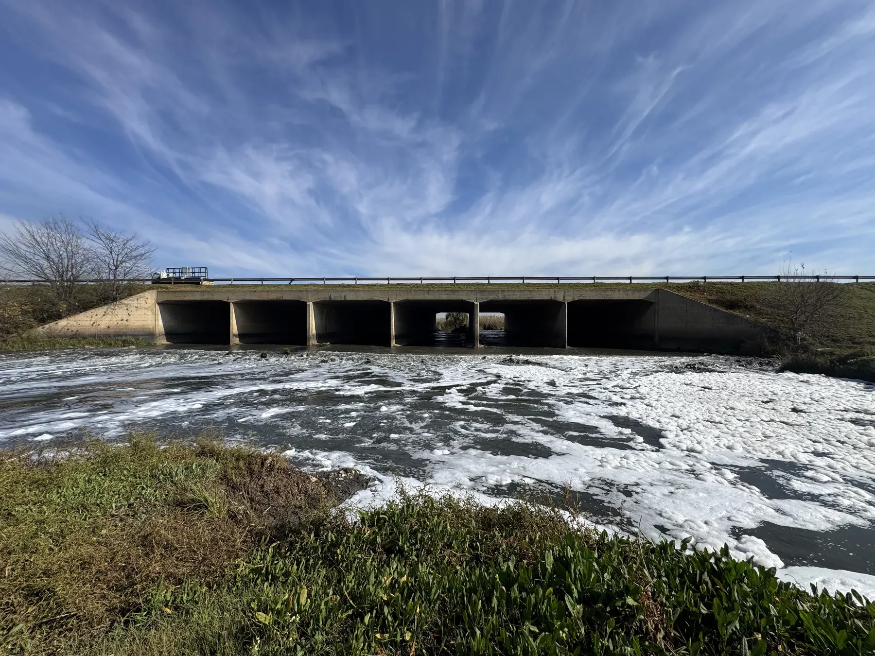 Engineers inspecting the Jukskei River, a canonical South African example of development built inside the floodline.