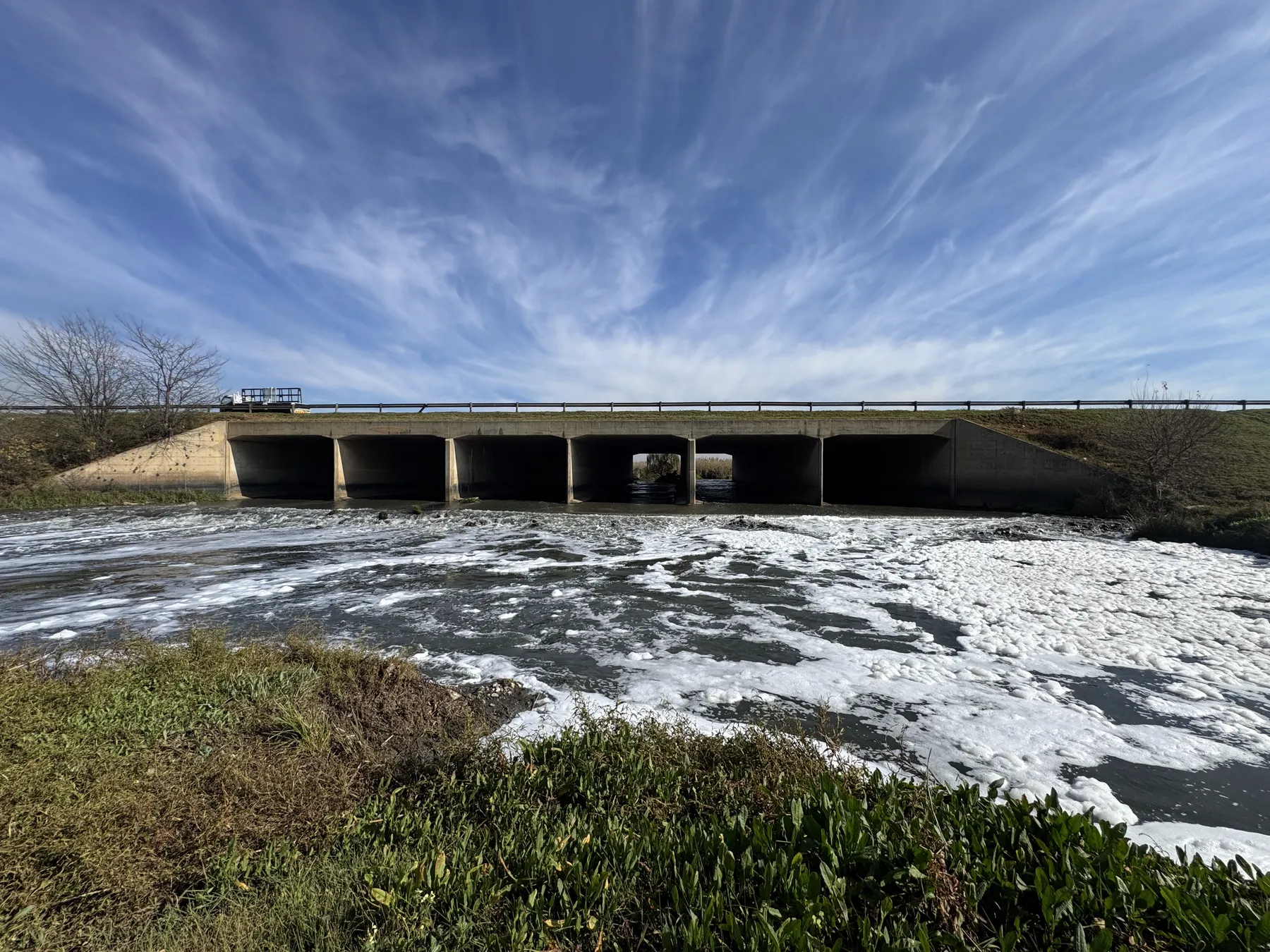 Engineers inspecting the Jukskei River, a canonical South African example of development built inside the floodline.