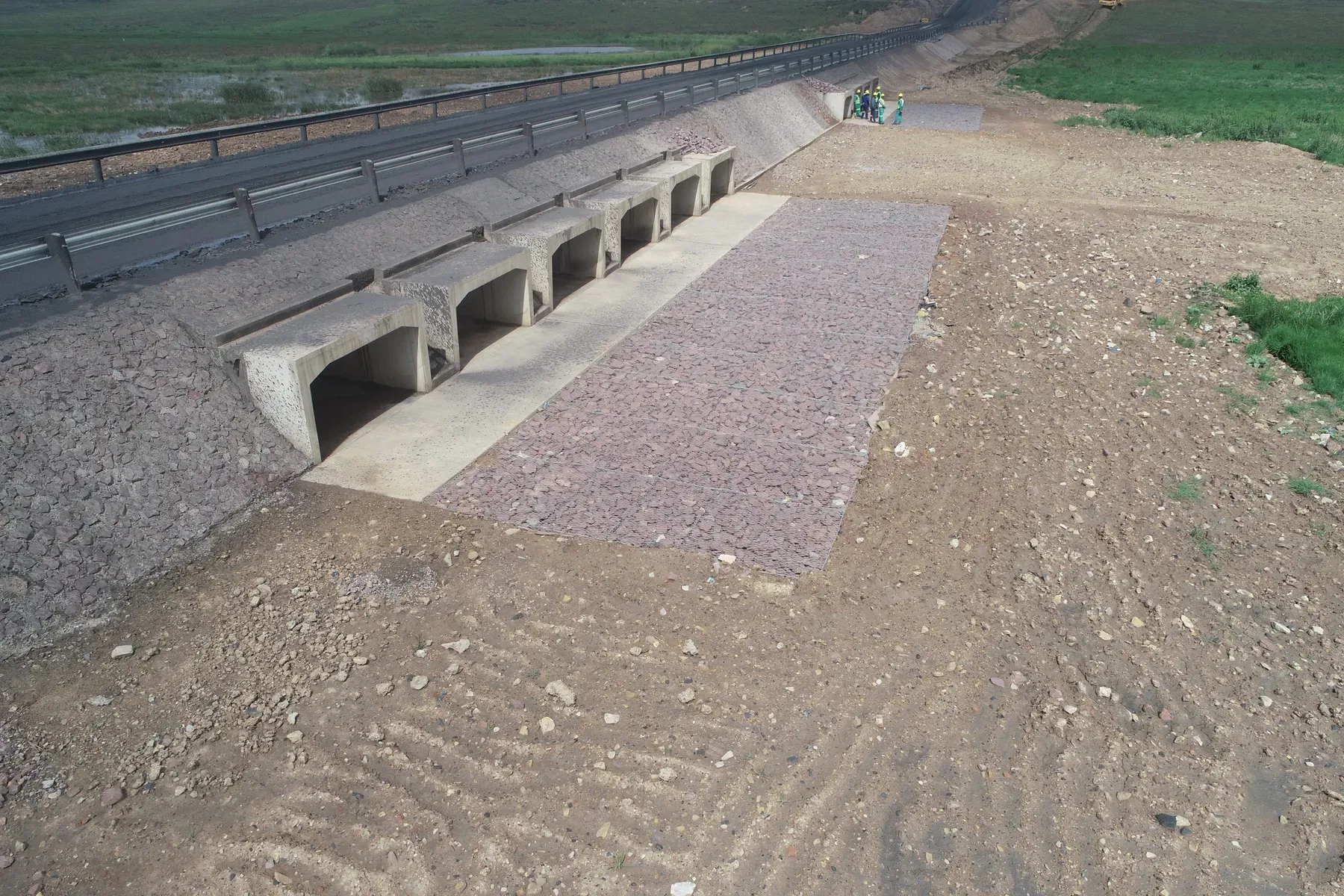 Rock and concrete erosion protection installed at a culvert outlet.