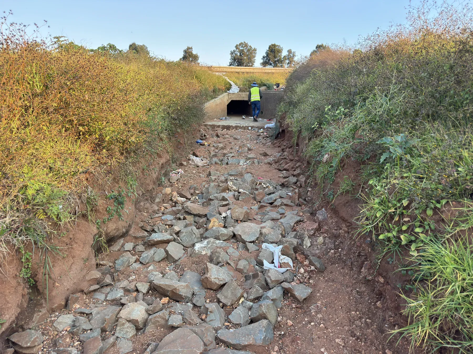 Displaced riprap and scour damage at a culvert outlet.